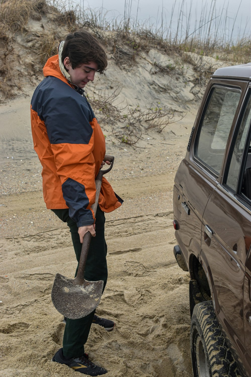 man holding shovel