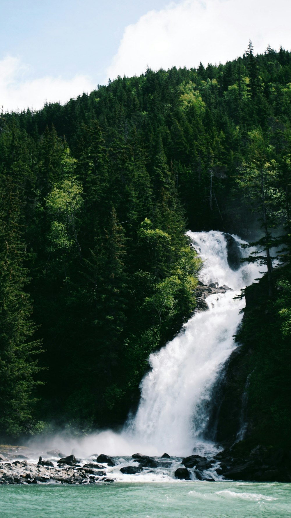 waterfalls with trees on sides