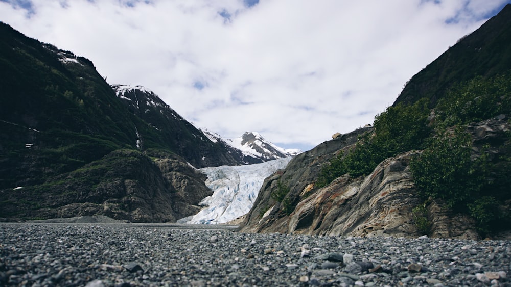 a mountain with a glacier in the background