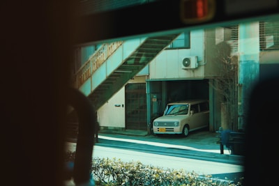 Closed garage space suitable for one car in a residential duplex.