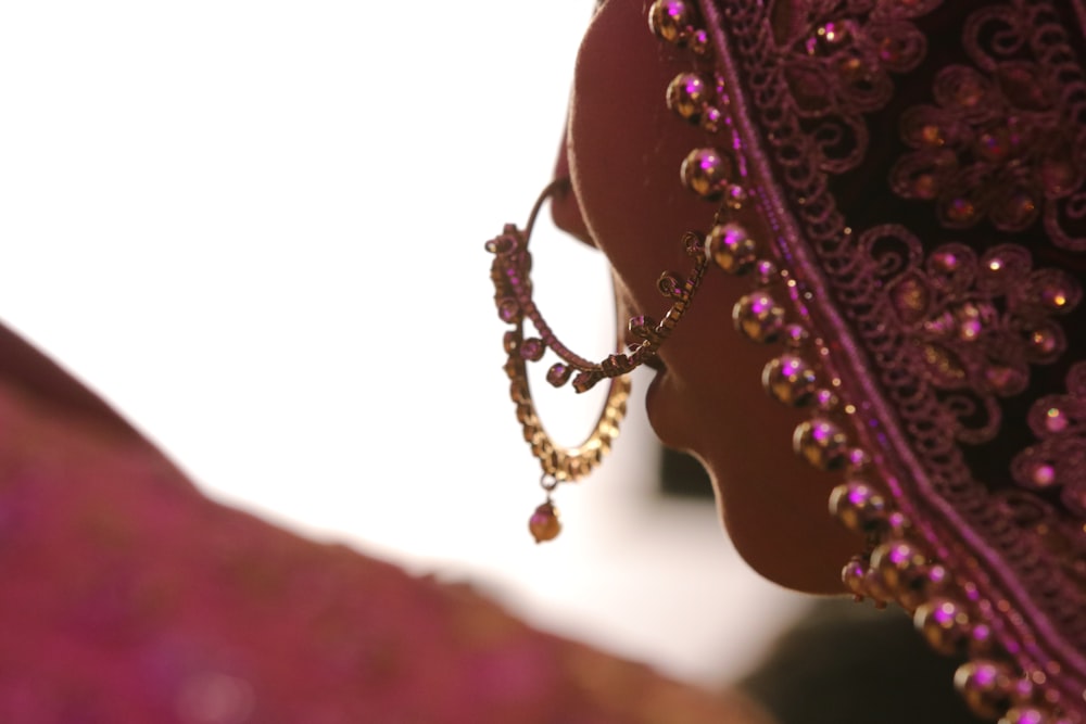 shallow focus photo of gold-colored jewelry