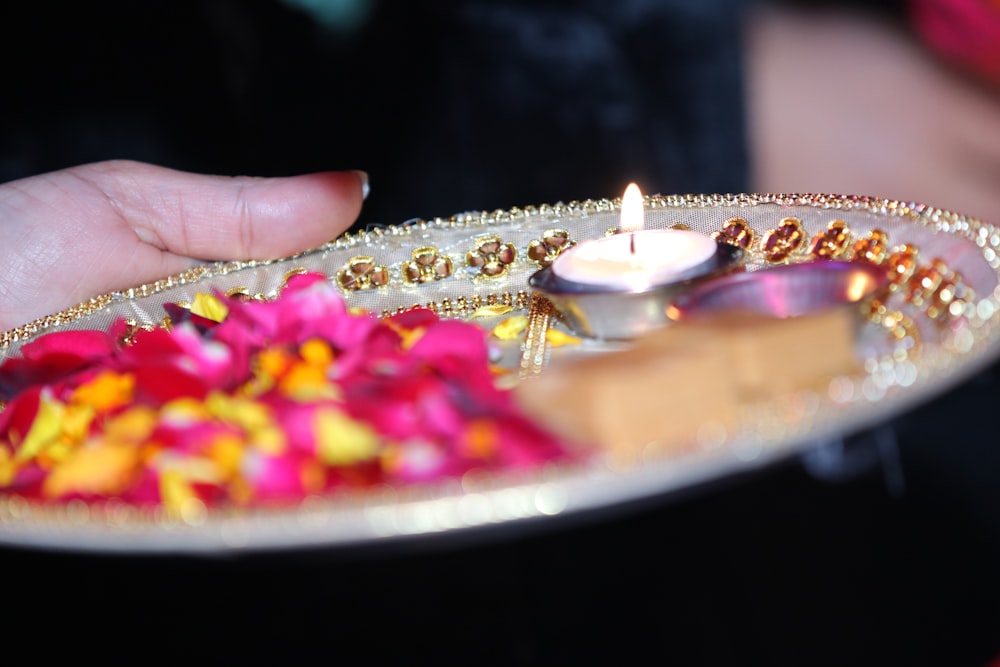 shallow focus photo of lighted votive candle