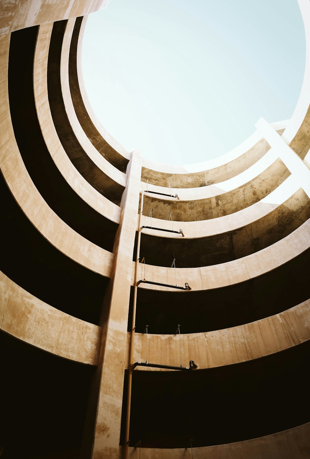 low-angle photography of round white ceiling structure