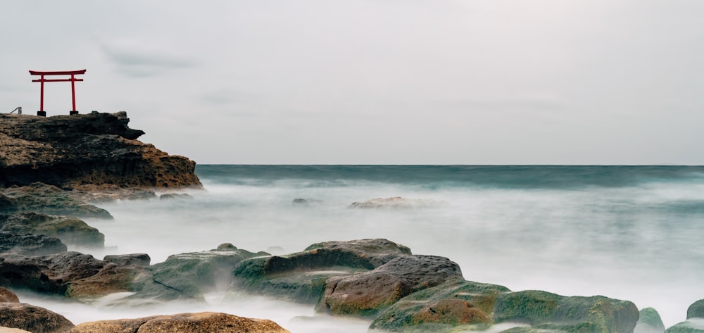 time-lapse photography of waves splashing on rocks
