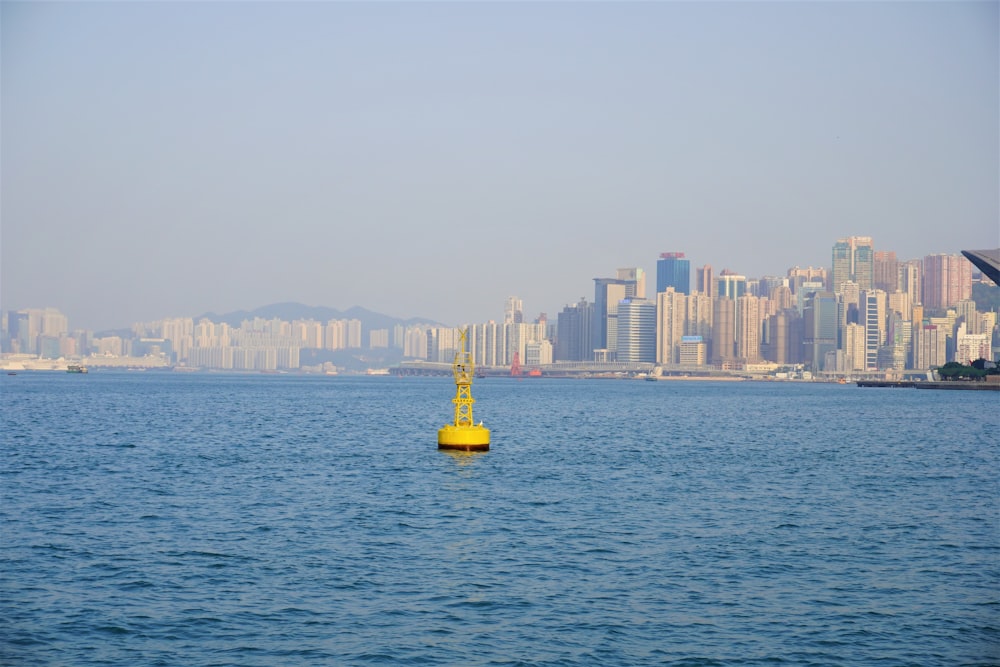 yellow buoy floating in the sea during daytime