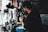 Barista preparing a fresh espresso shot in a modern coffee shop setting.