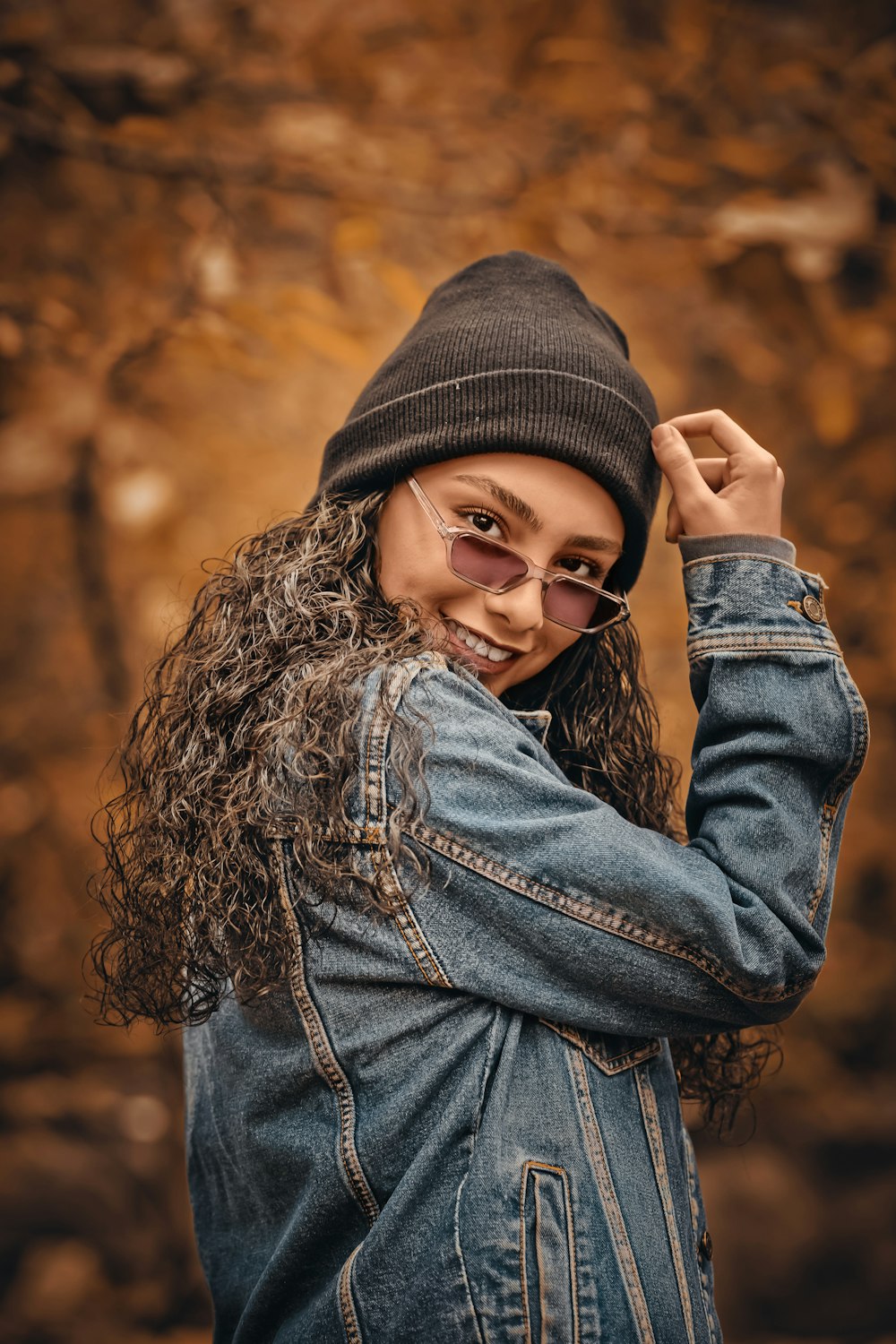 selective focus photography of woman wearing blue denim jacket