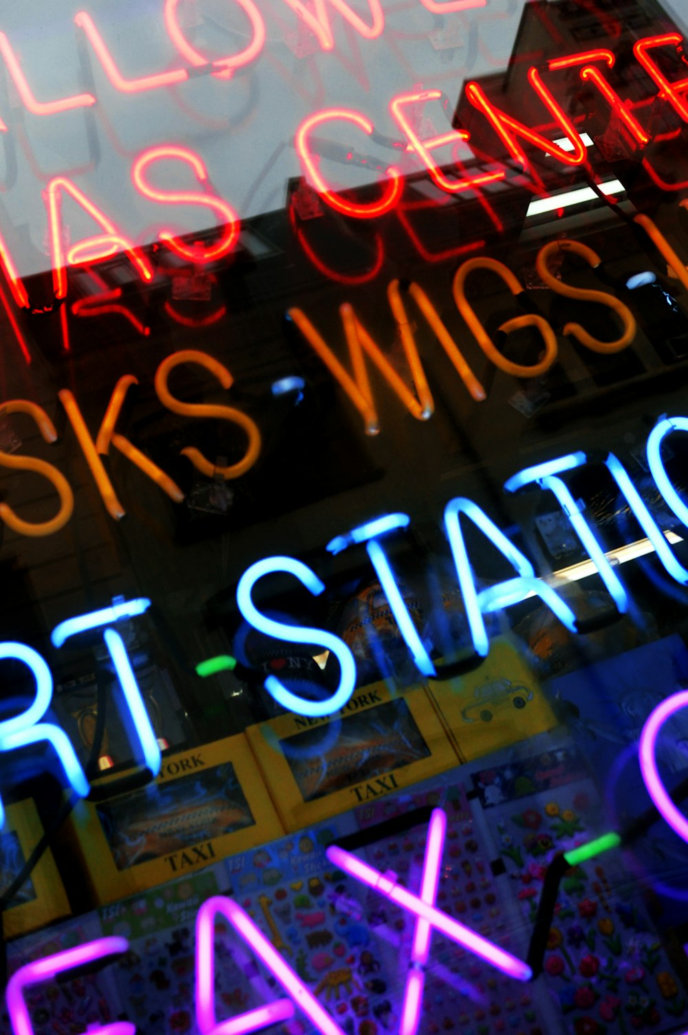 a neon sign in the window of a store