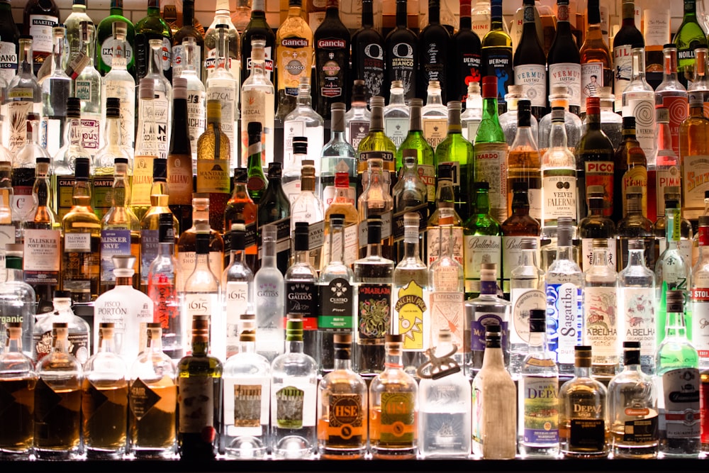 assorted liquor, wines, and whisky on display