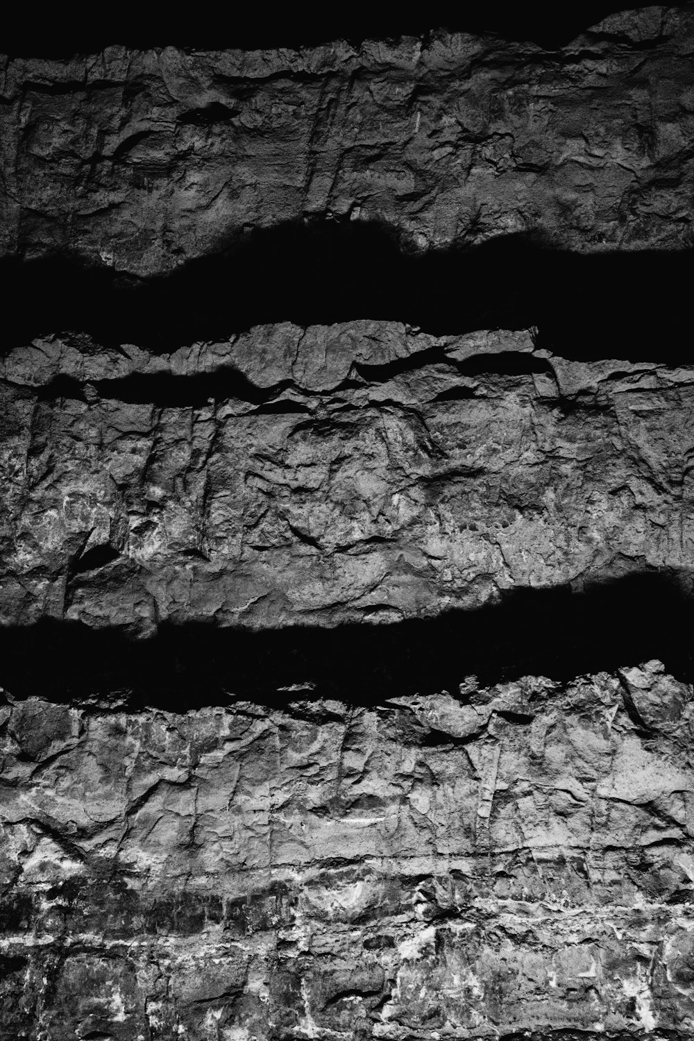a black and white photo of rock formations