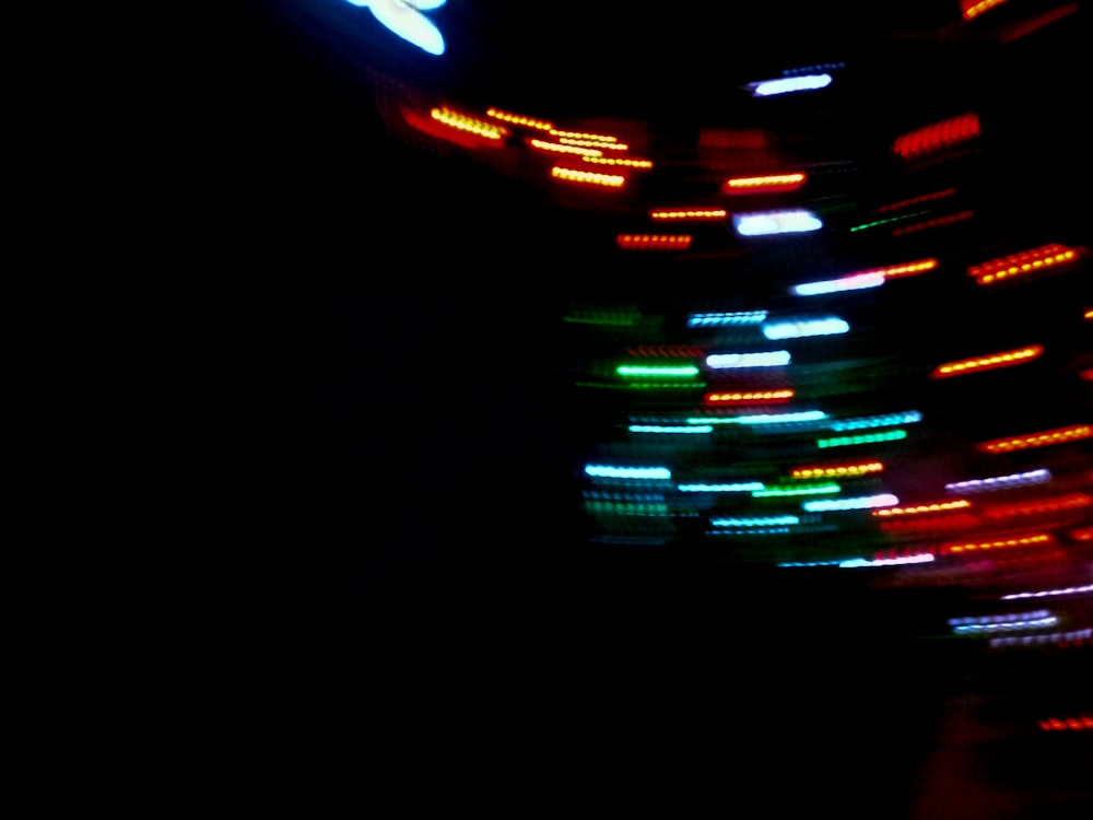 a blurry photo of a clock in the dark