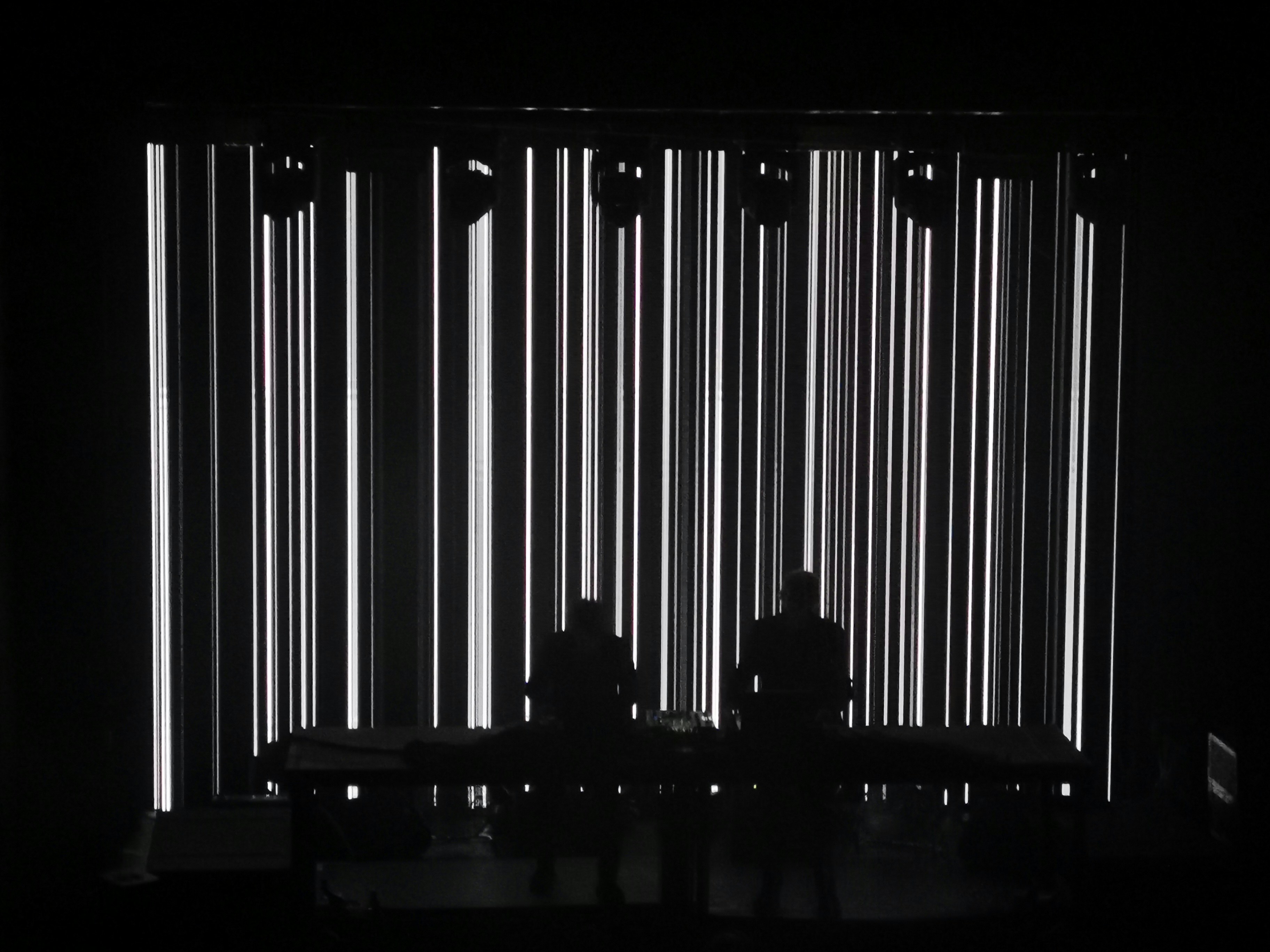 silhouette of two people standing