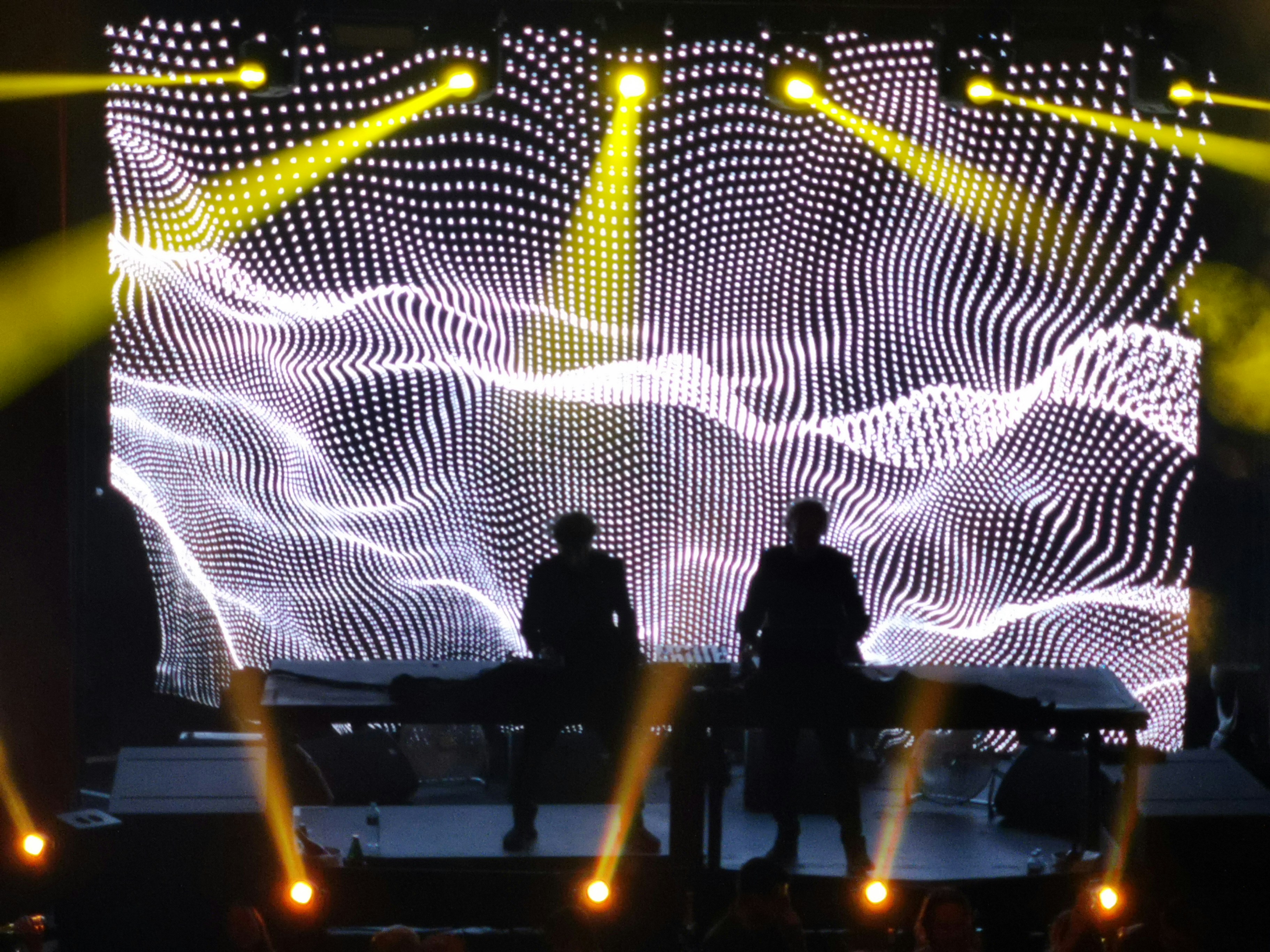 two persons standing on stage