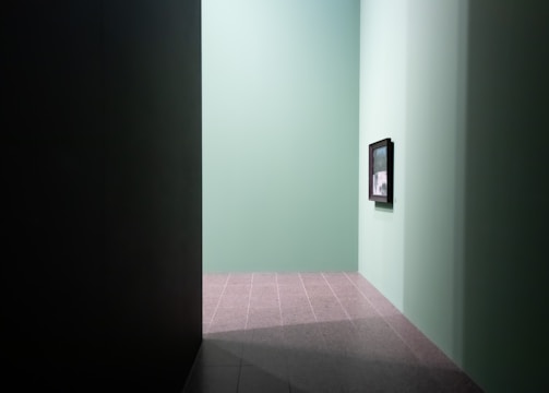Warm, muted green walls with soft lighting enhancing a feeling of safety and trust.