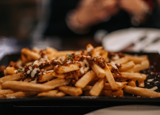 shallow focus photo of French fries