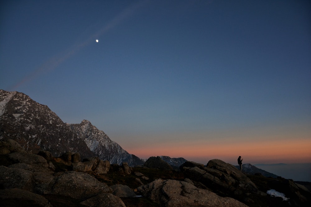 silhouette of mountains during nighttime