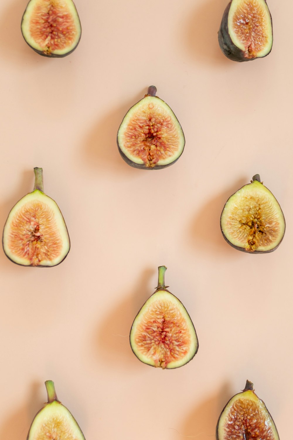 a group of sliced figs sitting on top of a table