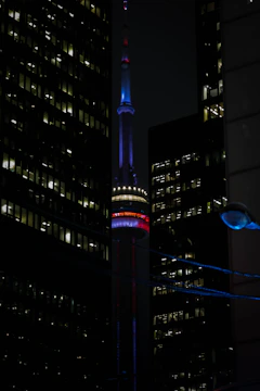 Night view of the Nasdaq building illuminated in New York City.