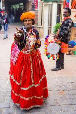two men dancing on street in an event