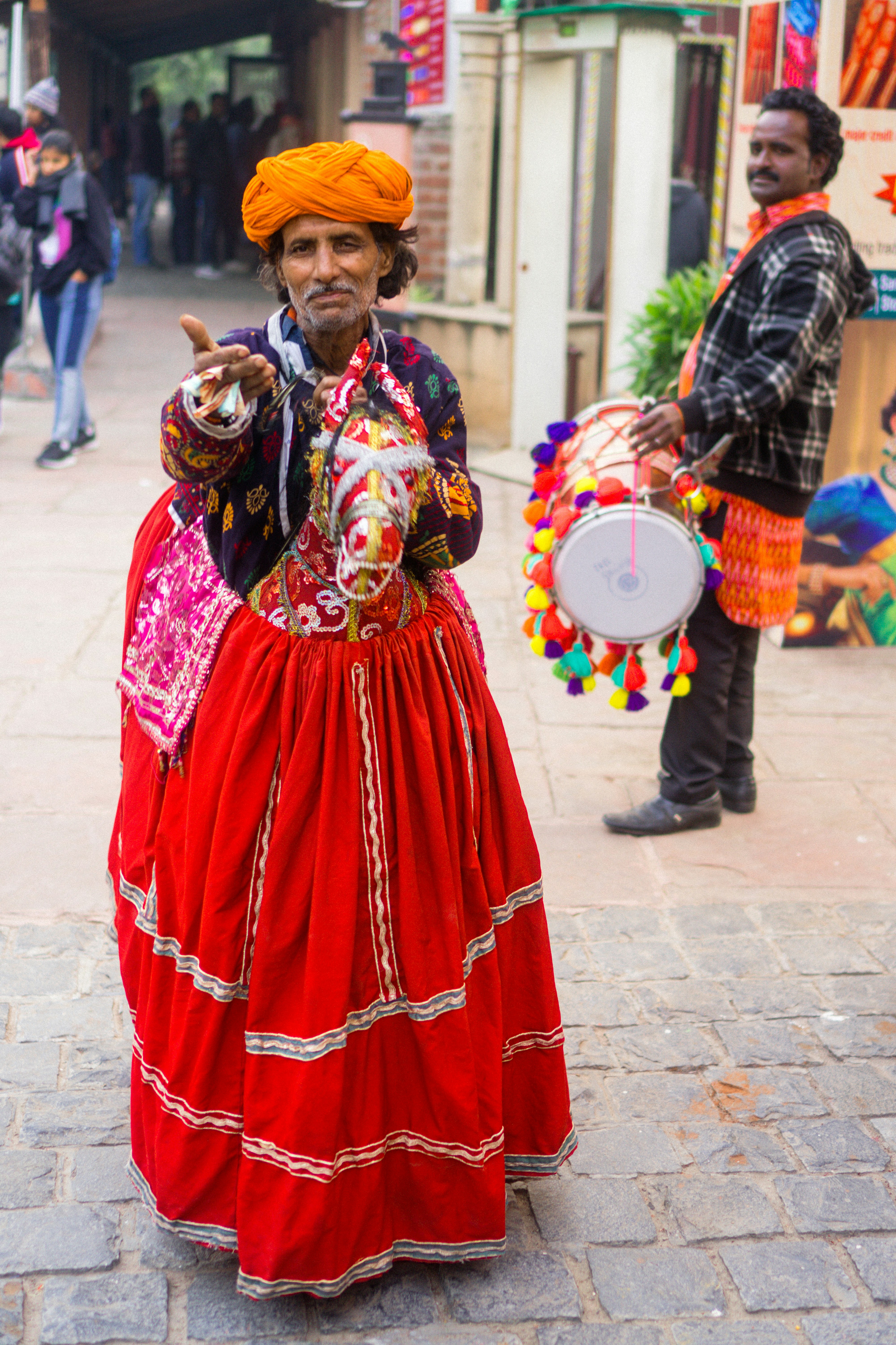 two men dancing on street in an event
