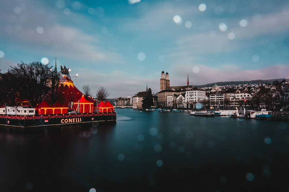 a boat with lights on it in a body of water