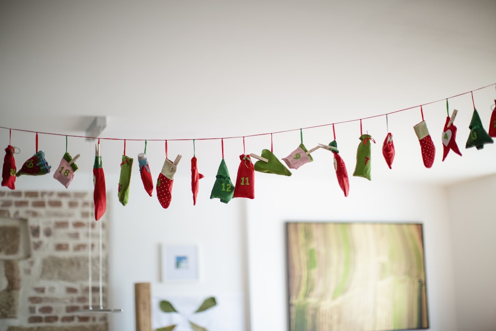 assorted Christmas decors hanging on string indoors