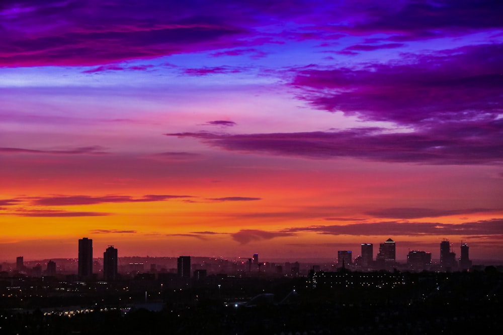 aerial photography of city with high-rise buildings during night time