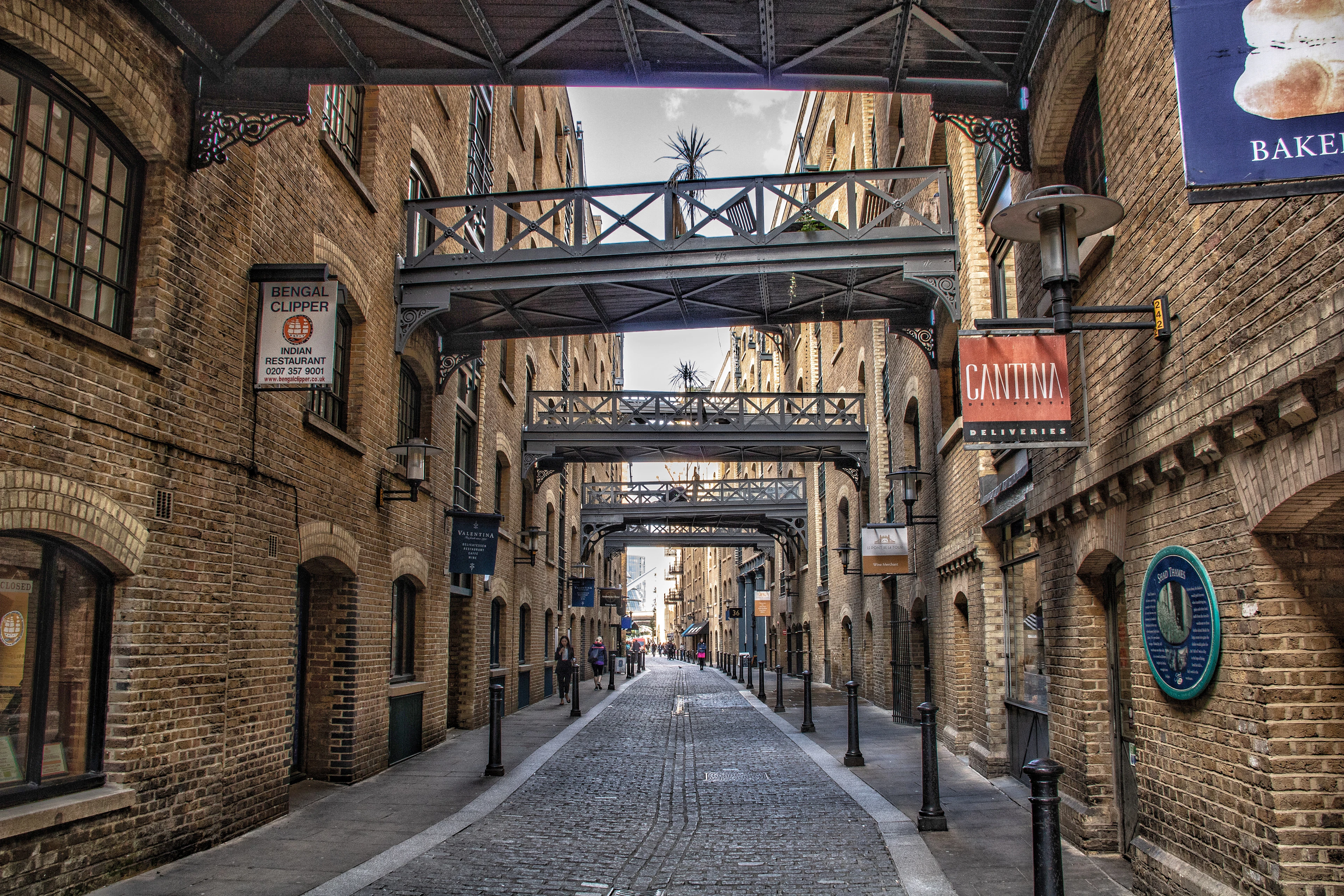 Iron walkways crossing the warehouse-lined street of Shad Thames
