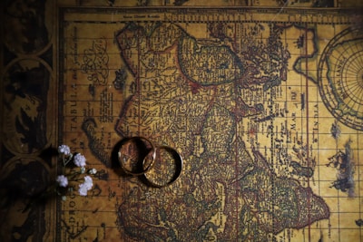 Elegant map of the UK with sterling silver and gold accents highlighting key landmarks.