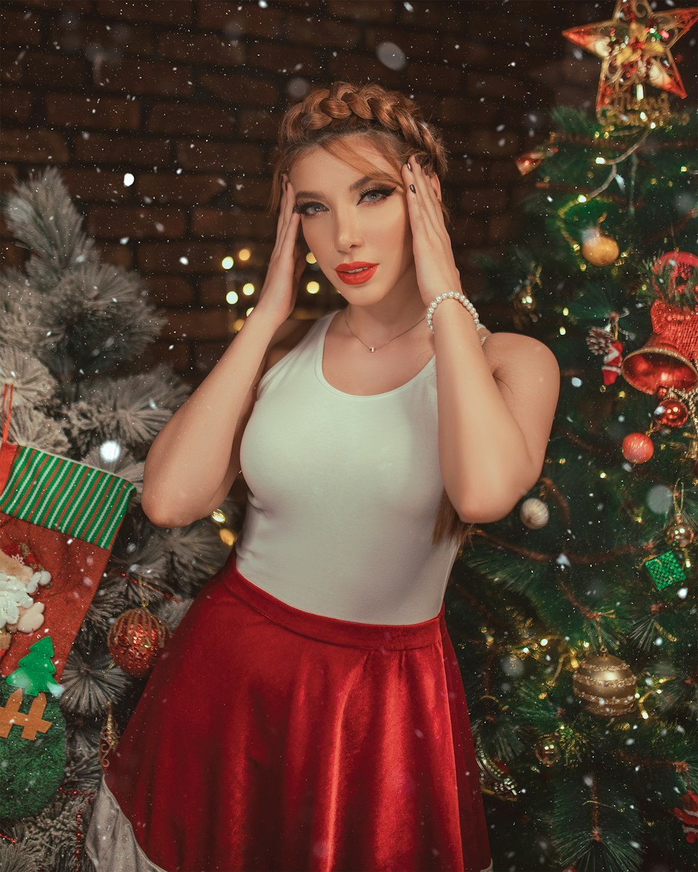 selective focus photography of woman wearing Santa costume beside Christmas tree