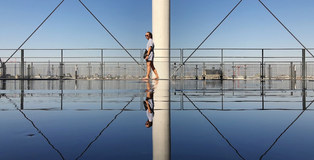 person walking near railing