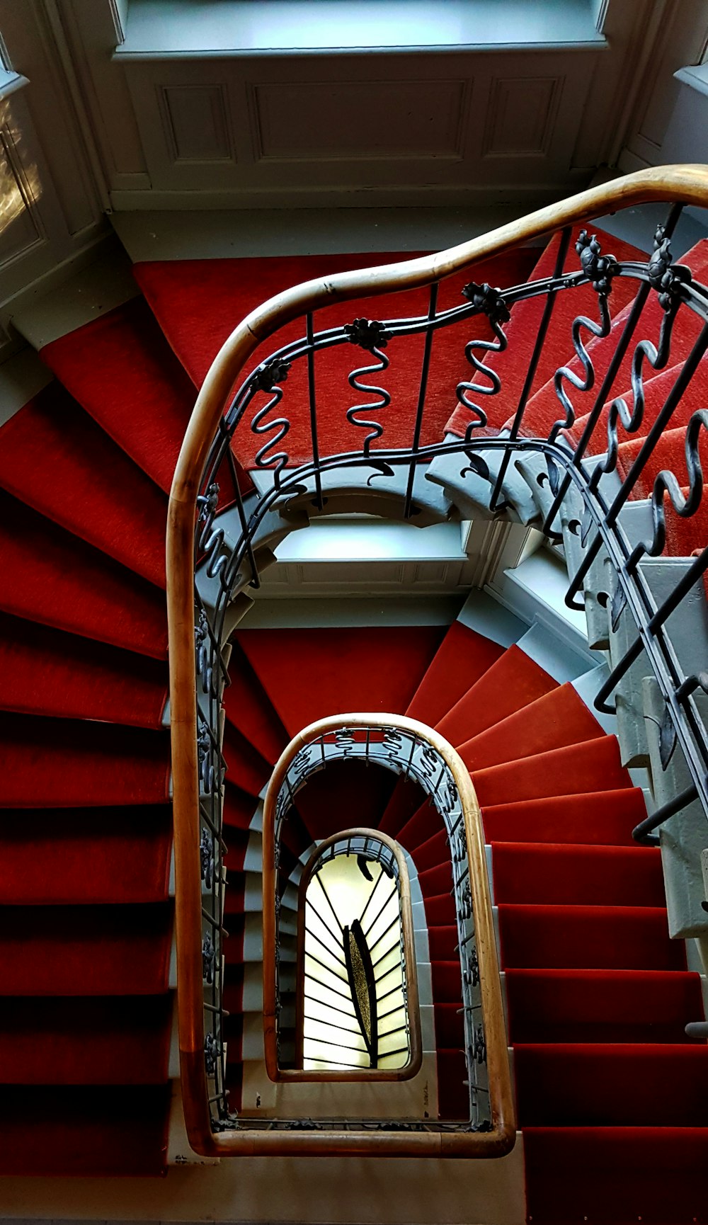 Man In Red Shirt Sitting On Stairs Photo Free Banister Image On