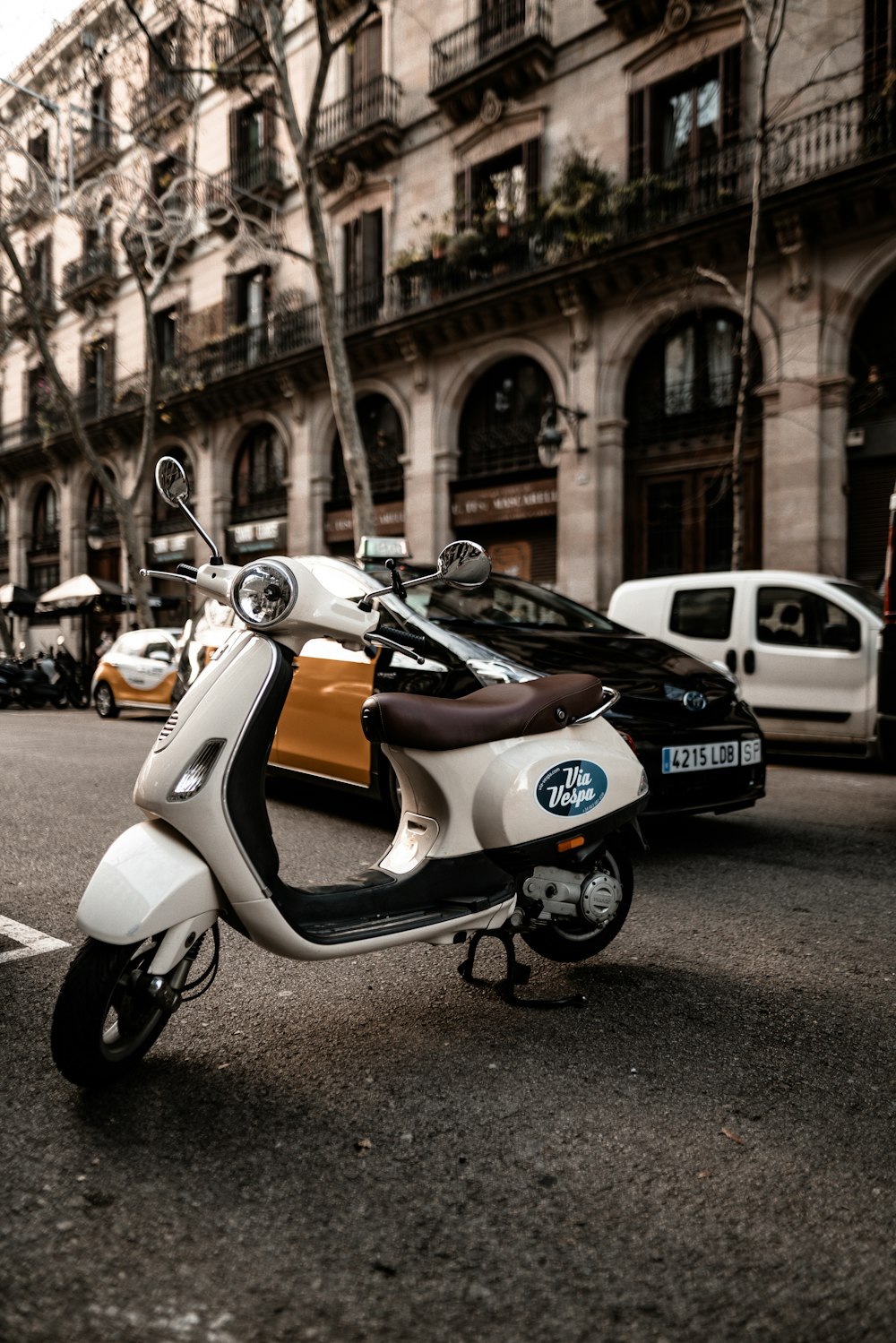 selective focus photography of parked white motor scooters