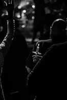 A candlelight vigil scene with flickering candles illuminating photos of children