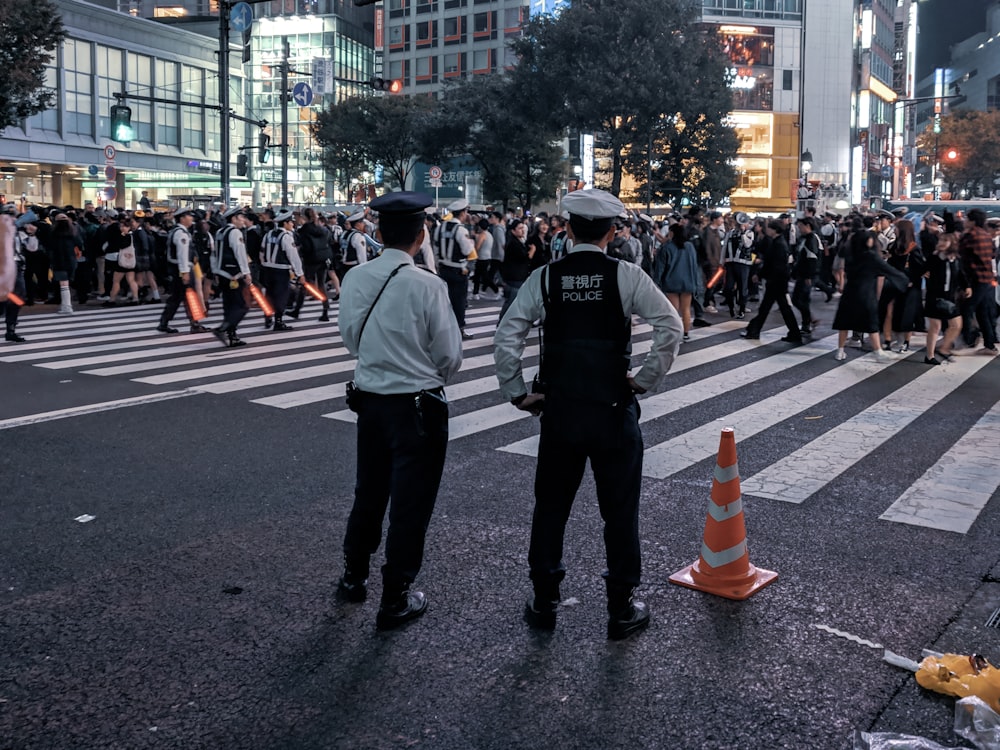 people crossing street during nighttime