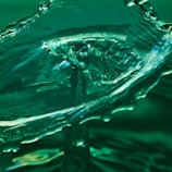A dynamic splash of water captured in mid-air with intricate details and smooth curves. The fluid motion conveys a sense of energy and elegance.