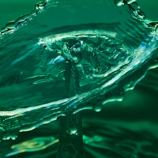 Abstract close-up of fluid water dynamics symbolizing sustainable innovation.
