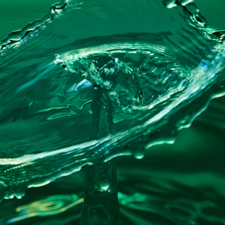 Abstract close-up of fluid water dynamics symbolizing sustainable innovation.