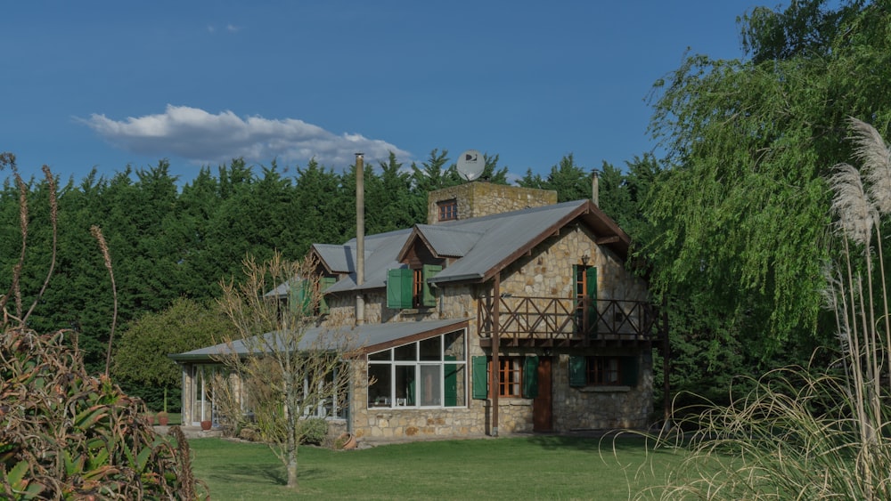 green trees beside wooden house during daytime