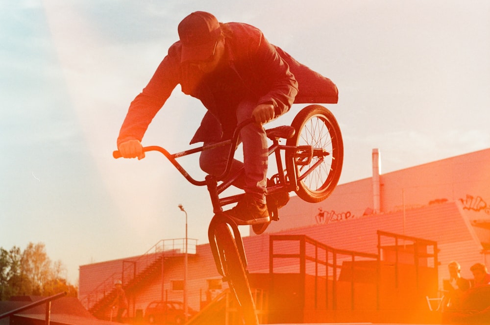 man riding BMX bicycle