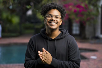 portrait photography of man wearing black pullover hoodie