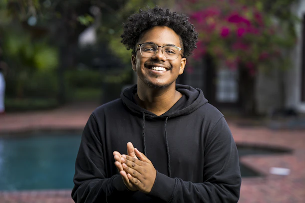 portrait photography of man wearing black pullover hoodie