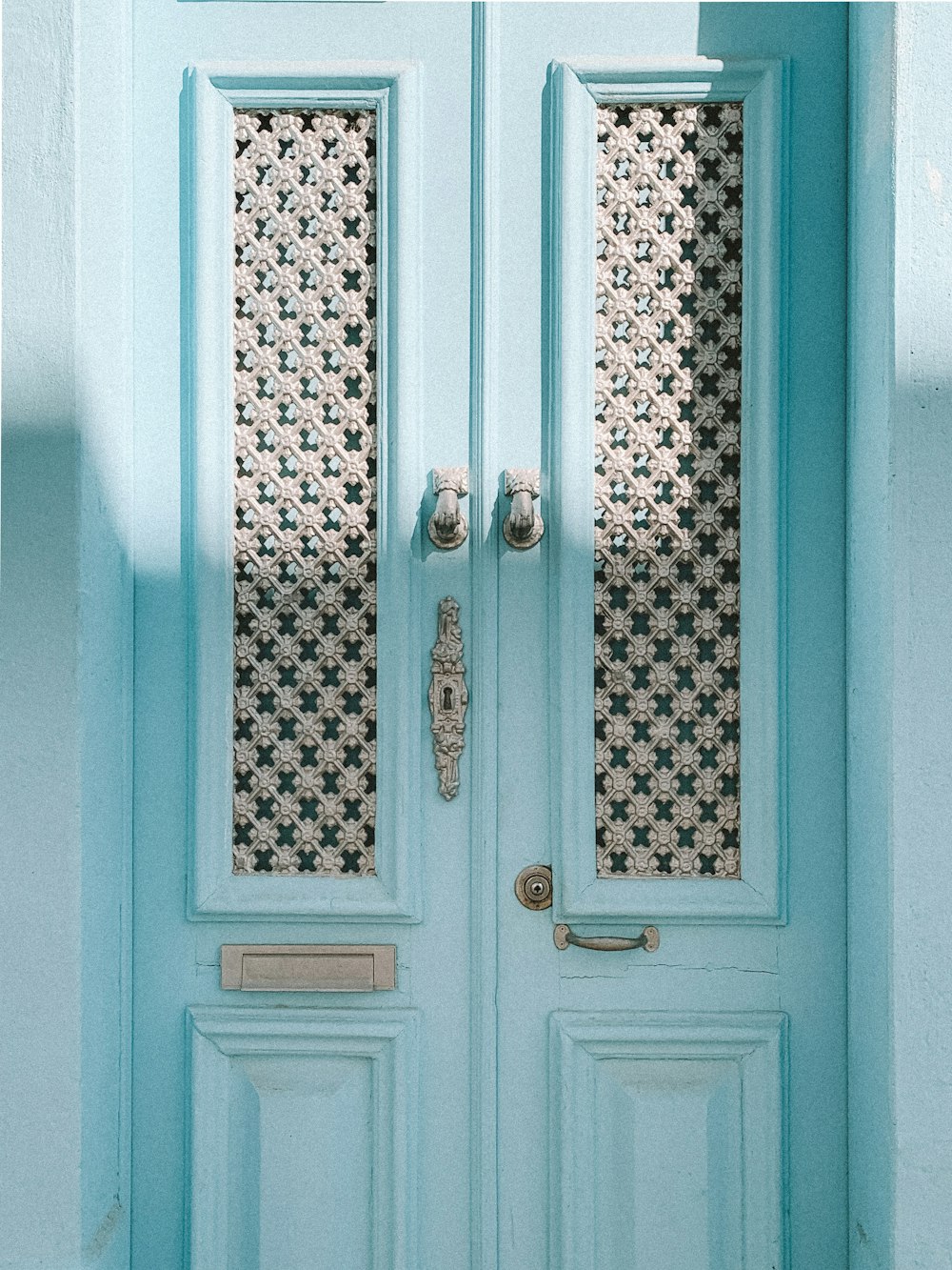 closed teal French doors