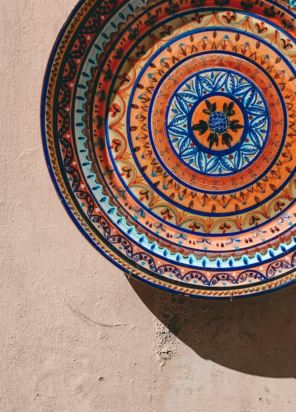 round multicolored bowl on gray surface