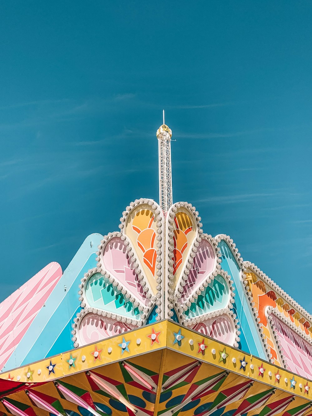 low-angle photography of multicolored building structure under blue sky