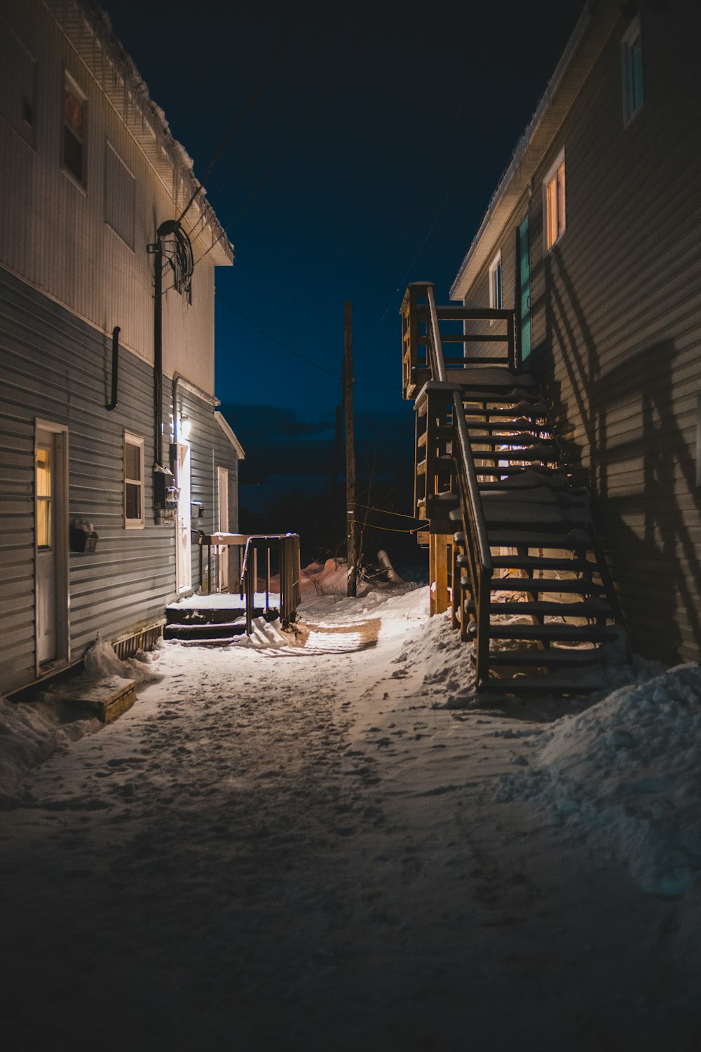 snow covered houses during night