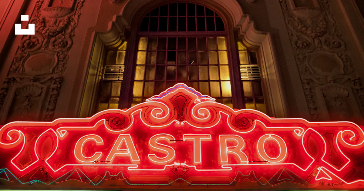 Castro Sf Sign A neon sign is lit up in front of a building photo – Free Castro ...