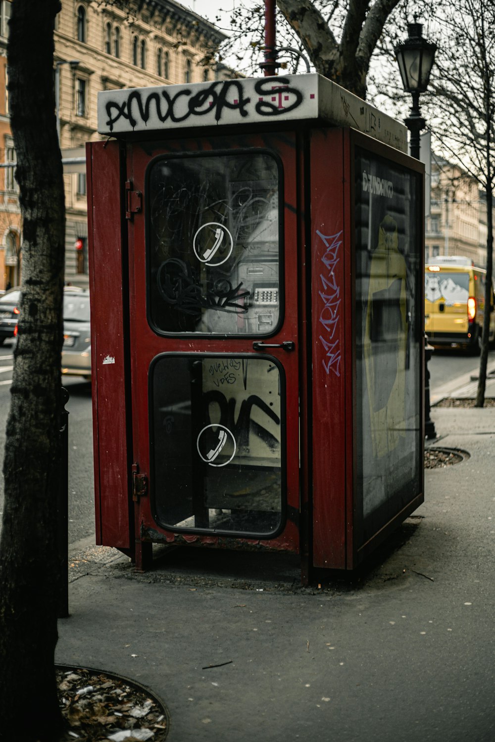 red and white booth beside trees