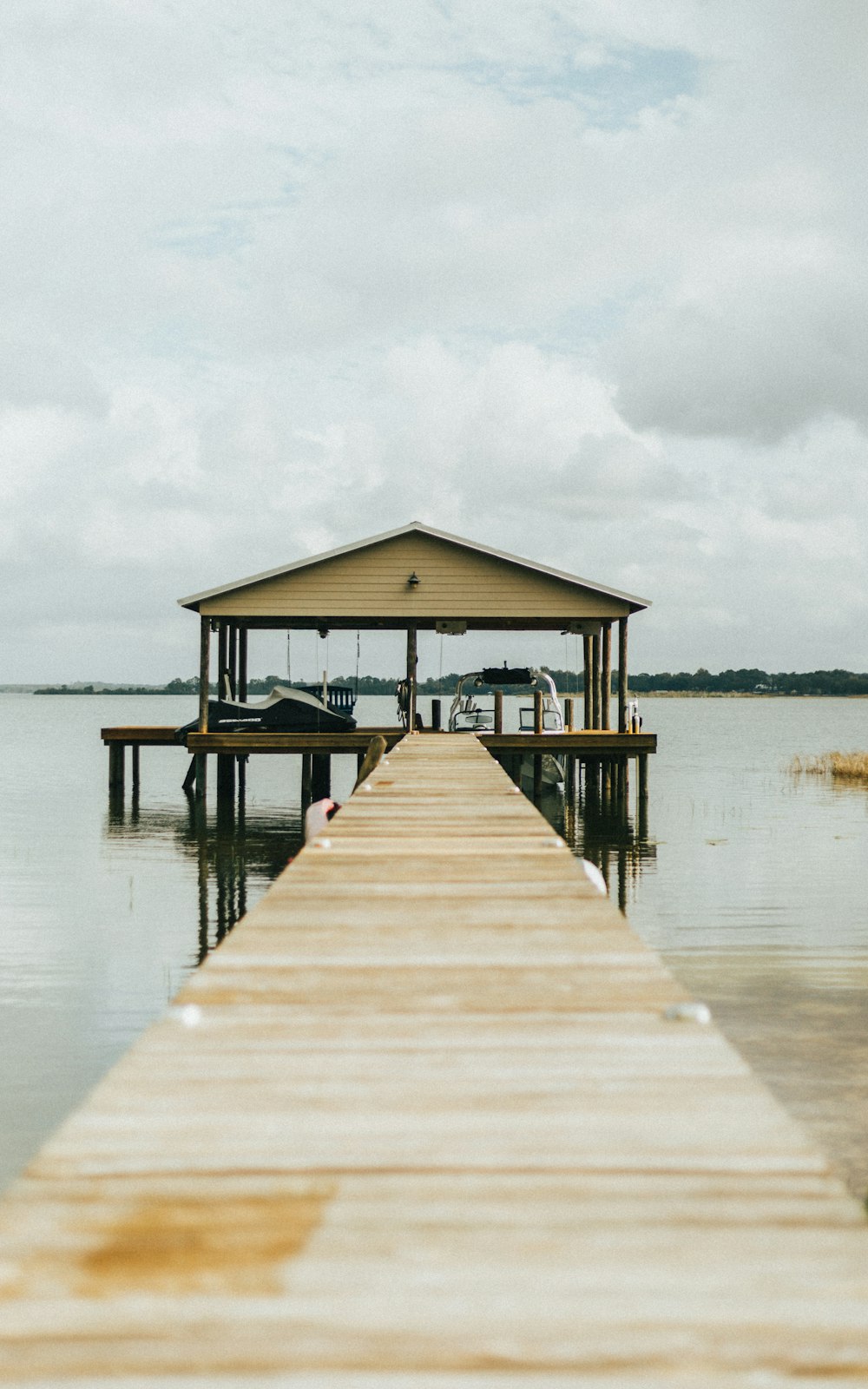 brown wooden dock with roof during day