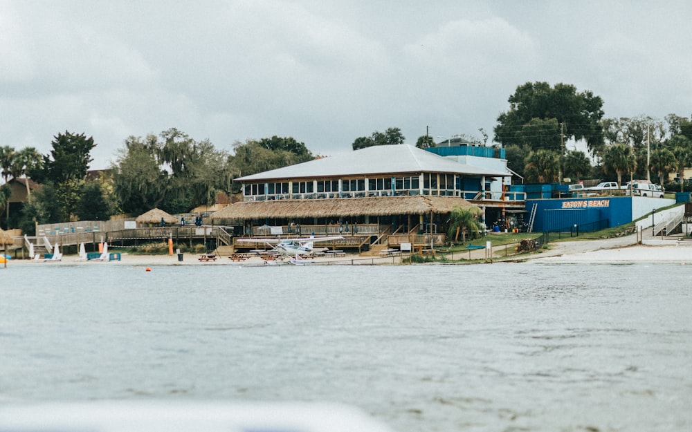 building and boats on shore during day